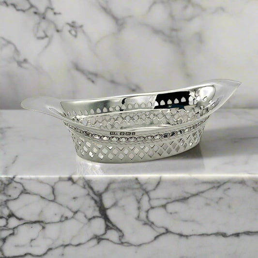Beautiful Antique oval silver pierced bowl on a marble worktop