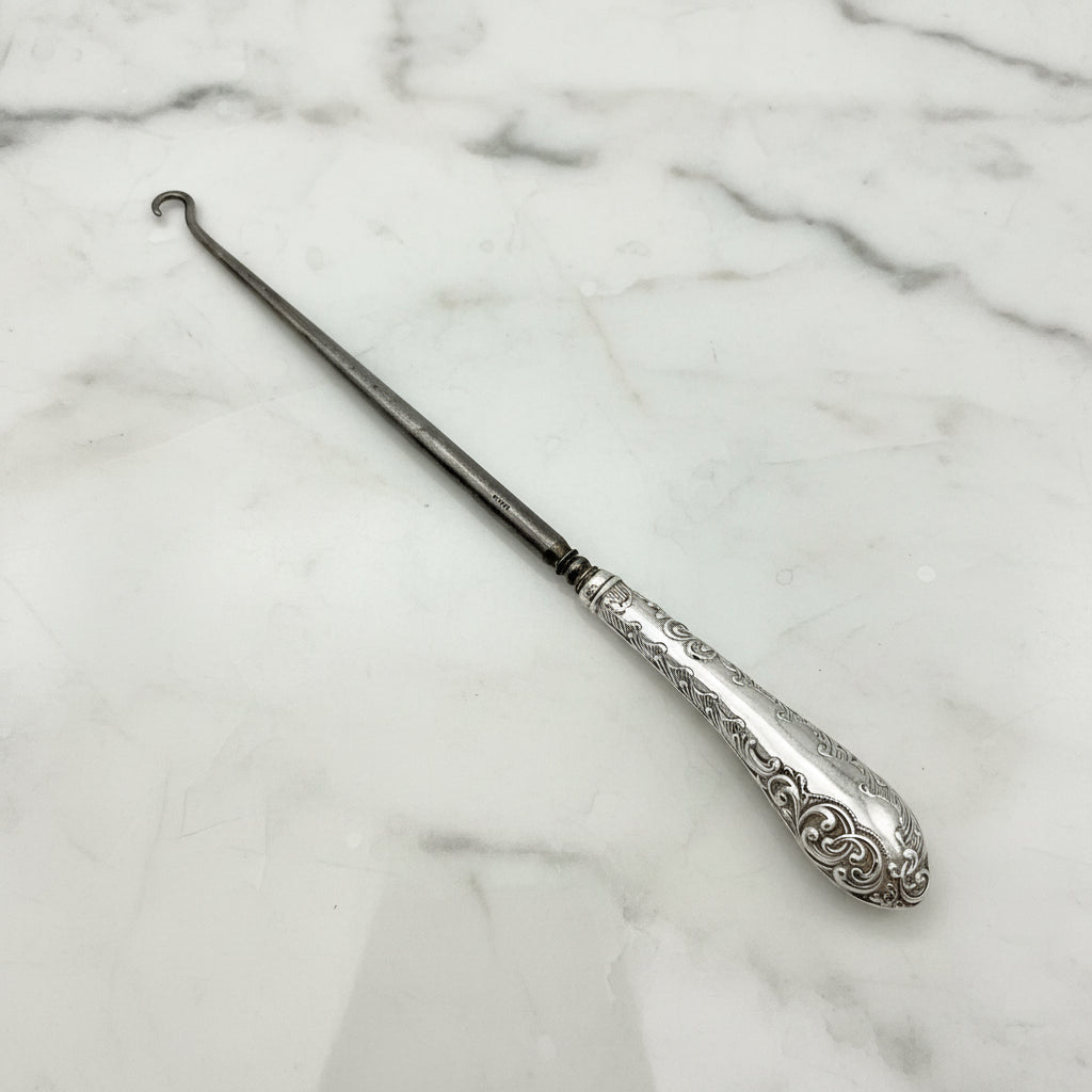 Beautiful Silver handled button hook featuring a scroll pattern