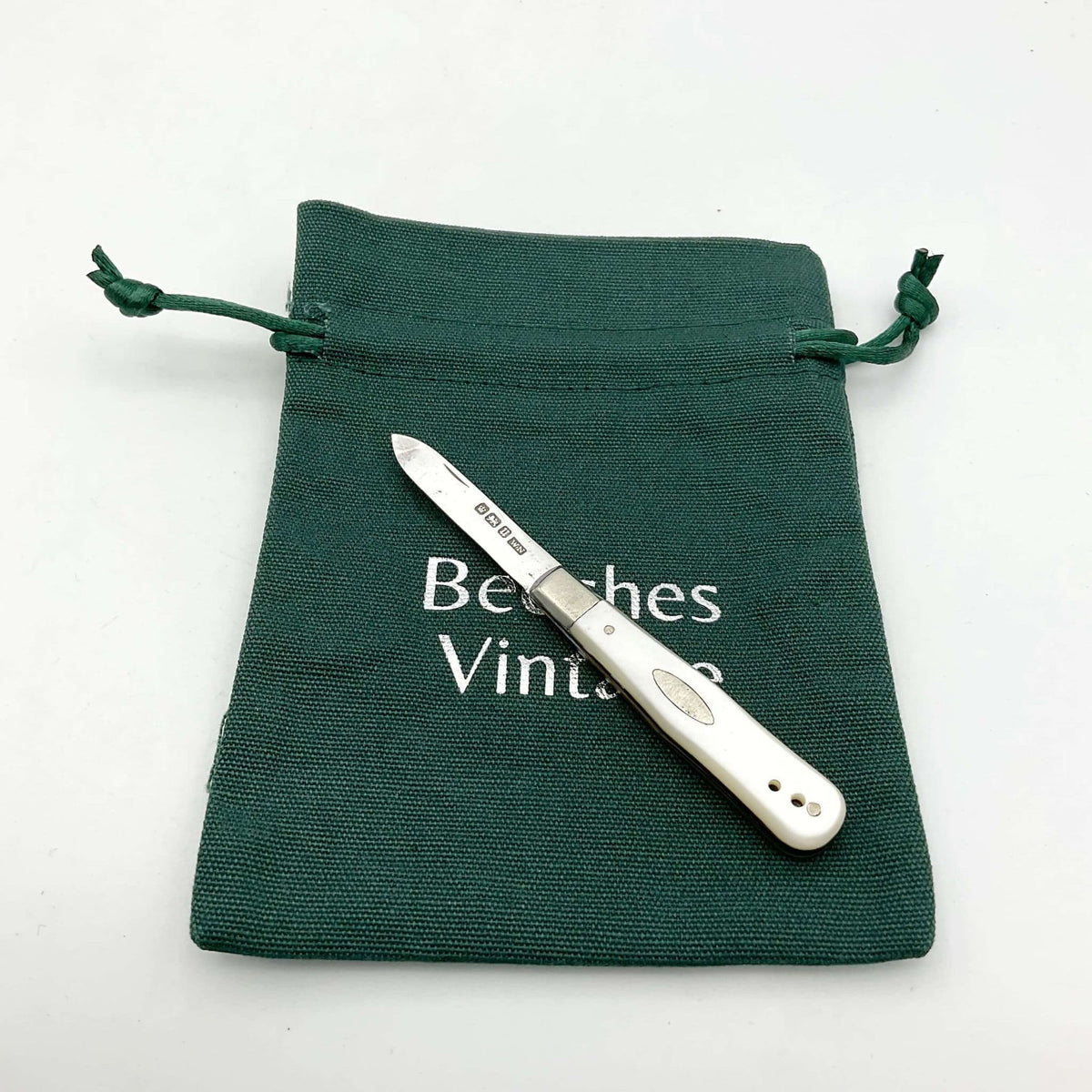 Antique Sterling Silver Fruit Knife with 1912 hallmark, vintage Beeches Silverware, elegant design, detailed craftsmanship visible in the image.