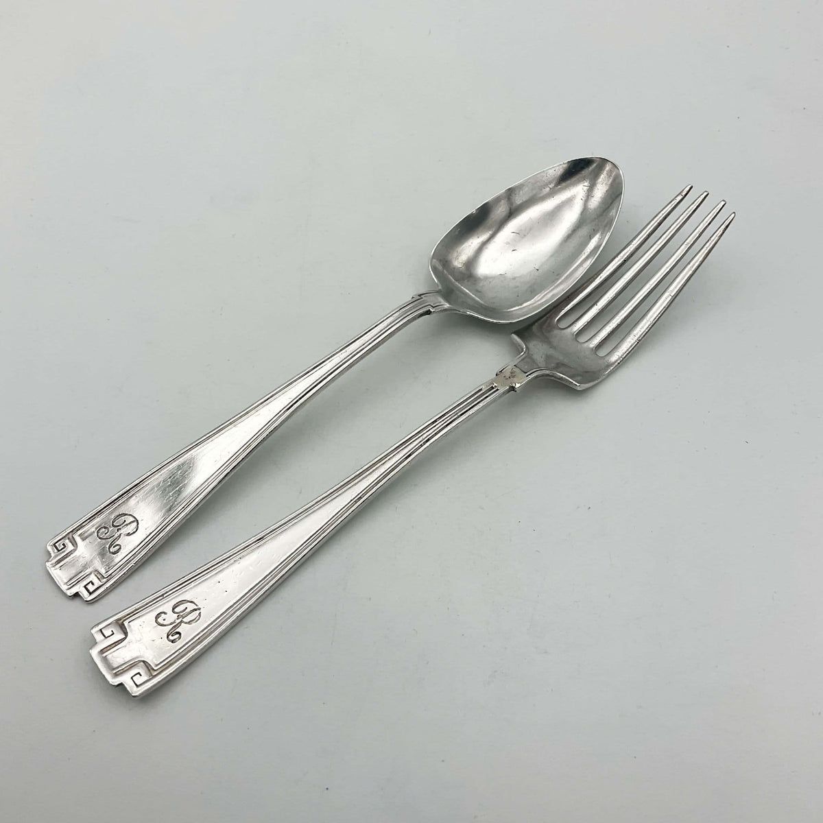 Antique small silver spoon and fork set by Beeches Vintage, perfect as a christening gift, with intricate vintage design.