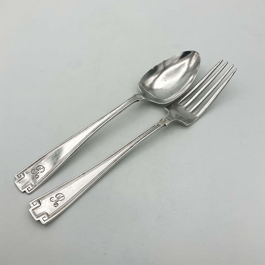 Antique small silver spoon and fork set by Beeches Vintage, perfect as a christening gift, with intricate vintage design.