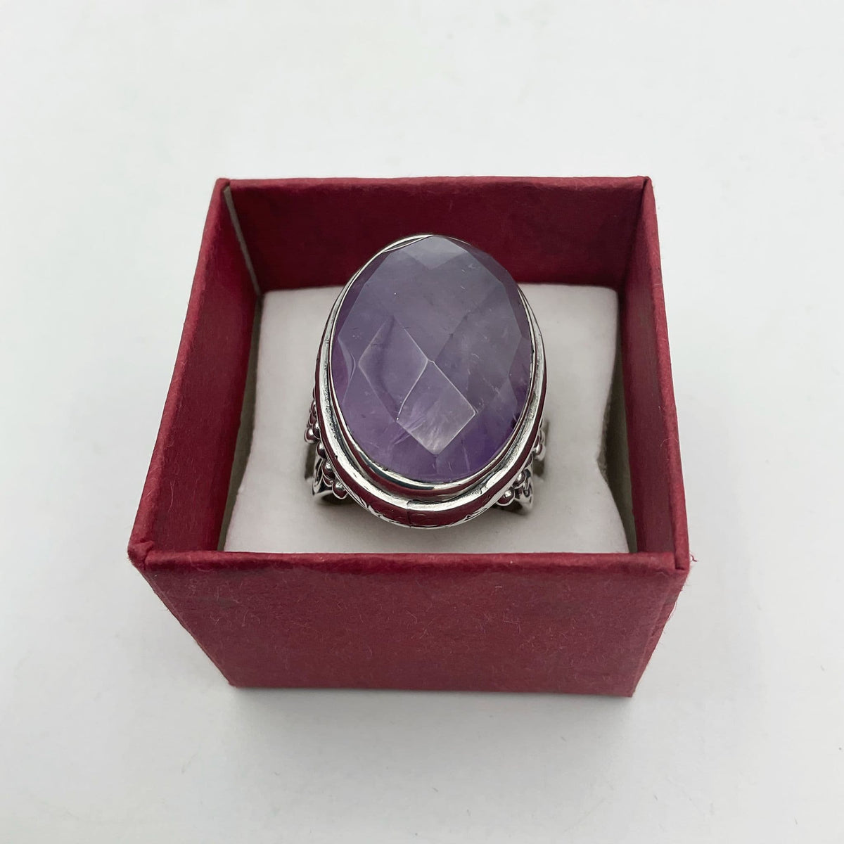 Large purple amethyst sterling silver ring featuring a bold amethyst gemstone set in a detailed sterling silver band.