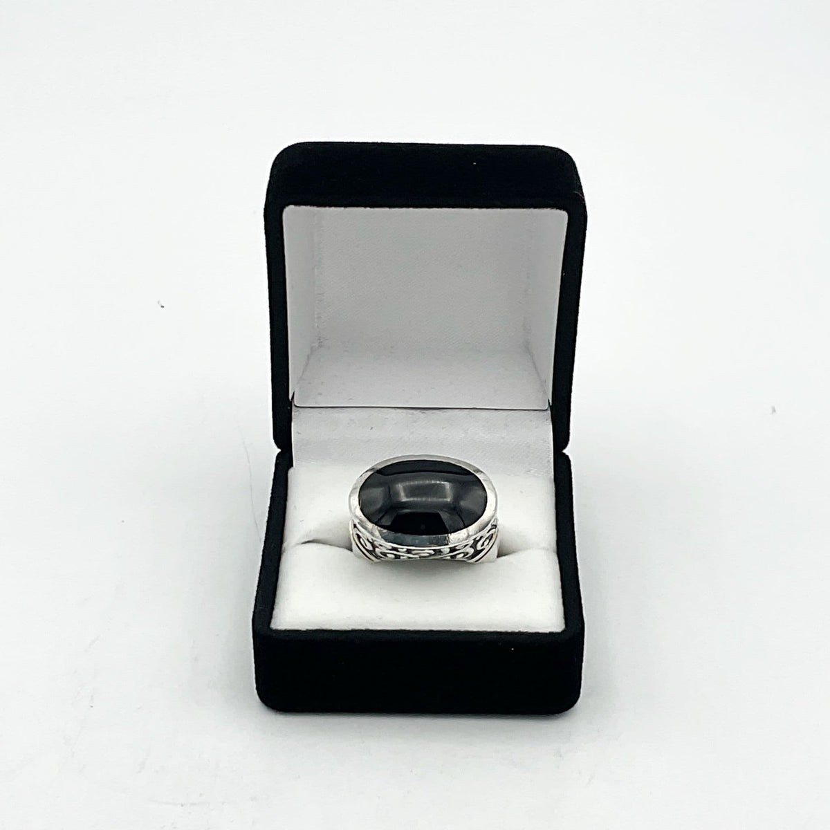 Oval black onyx silver ring featuring a polished gemstone set in a sleek silver band by Beeches Vintage.