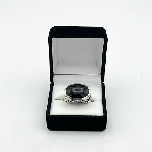 Oval black onyx silver ring featuring a polished gemstone set in a sleek silver band by Beeches Vintage.