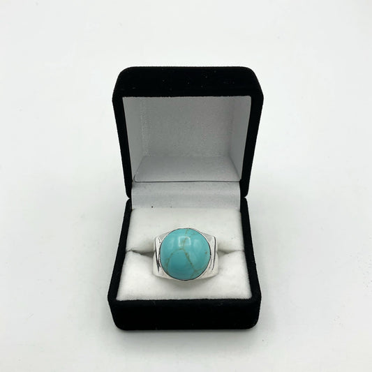 Polished turquoise silver ring by Beeches Vintage featuring a smooth turquoise stone set in a silver band.