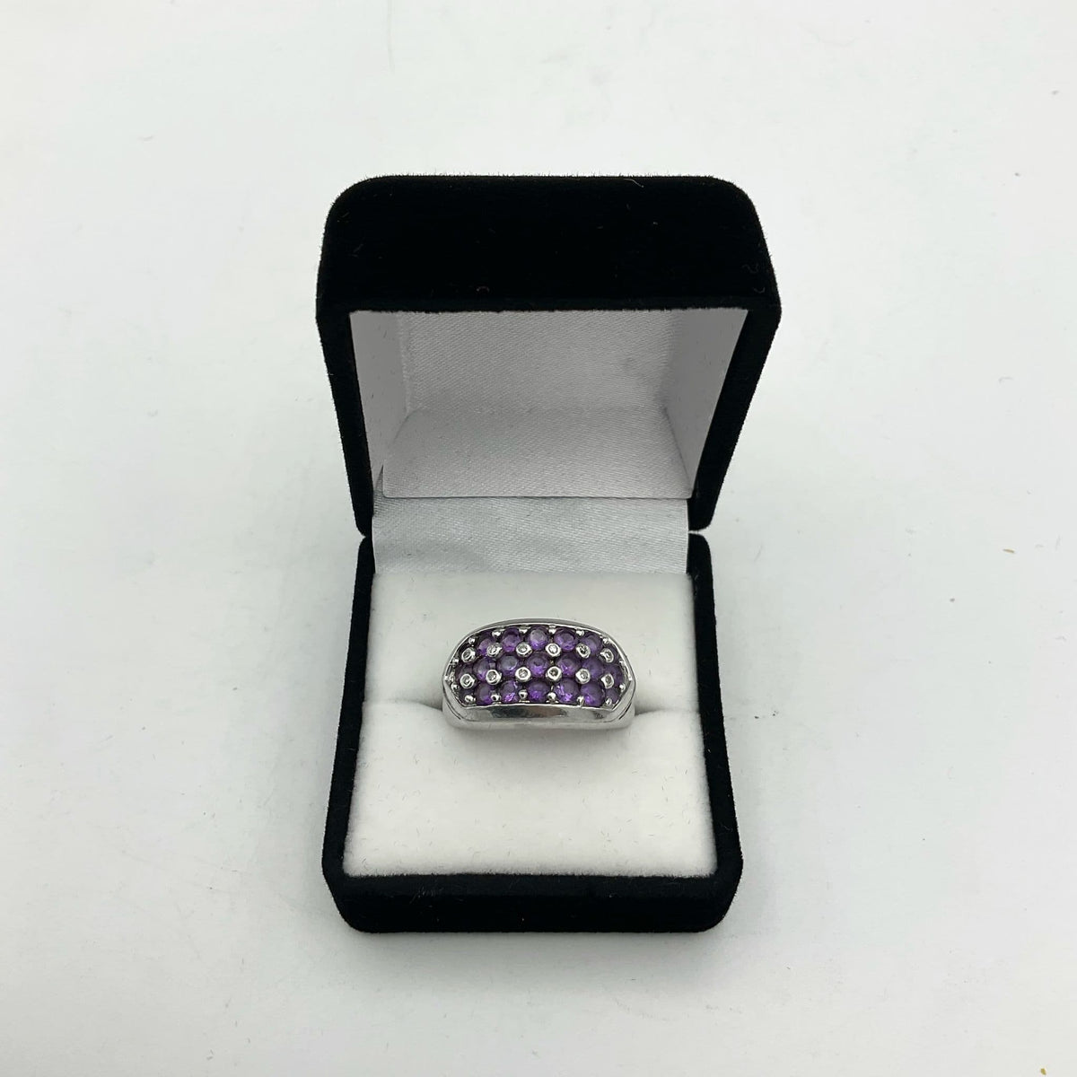 Purple Amethyst sterling silver ring featuring a polished amethyst gemstone set in a detailed silver band.