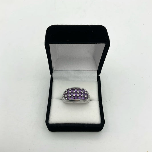Purple Amethyst sterling silver ring featuring a polished amethyst gemstone set in a detailed silver band.