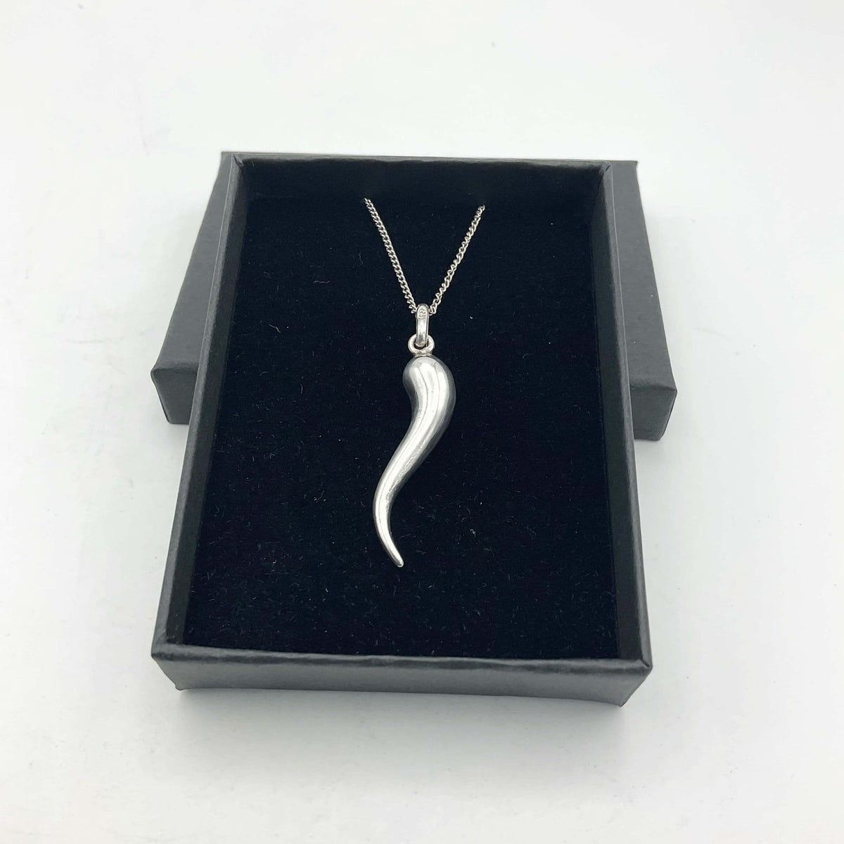 Silver drop pendant necklace by Beeches Vintage featuring a sleek, elegant silver pendant on a delicate chain.
