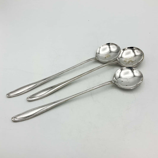 Set of silver-plated long-handled dessert spoons from Beeches Vintage, featuring elegant, polished handles and rounded spoon bowls.